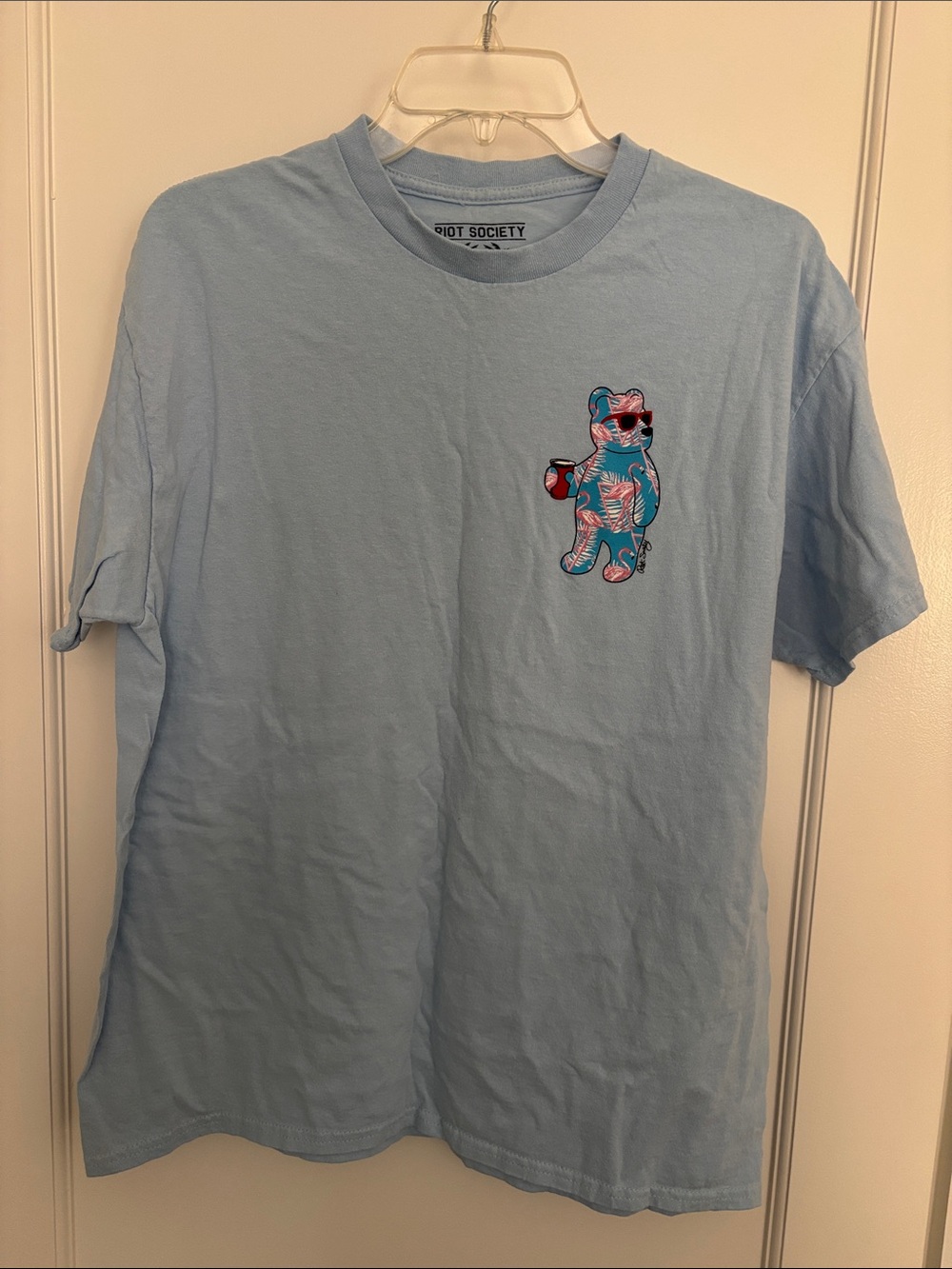 riot society light blue tee with colorful tropical bear graphic